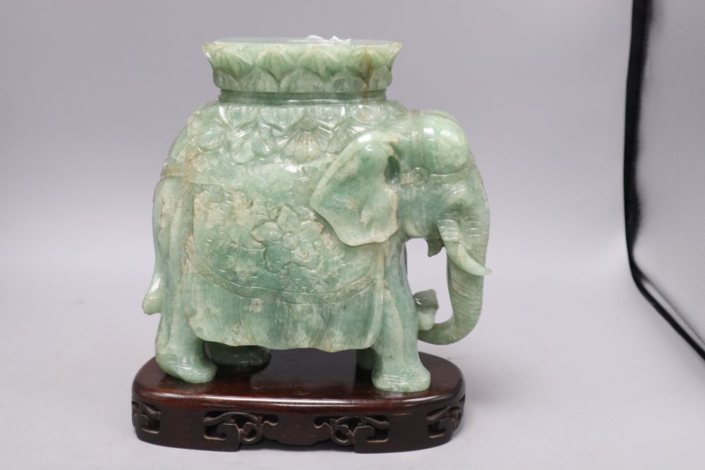 A large Chinese stone carving of elephant, with wood stand, overall 26cm
